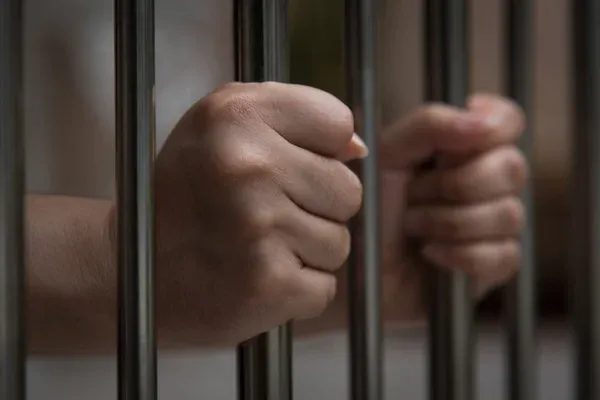 depositphotos_105014406-stock-photo-hand-in-jail