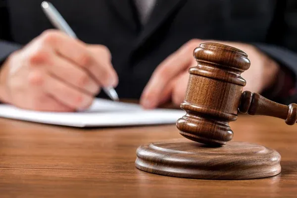depositphotos_114712380-stock-photo-gavel-judge-with-lawyer-working